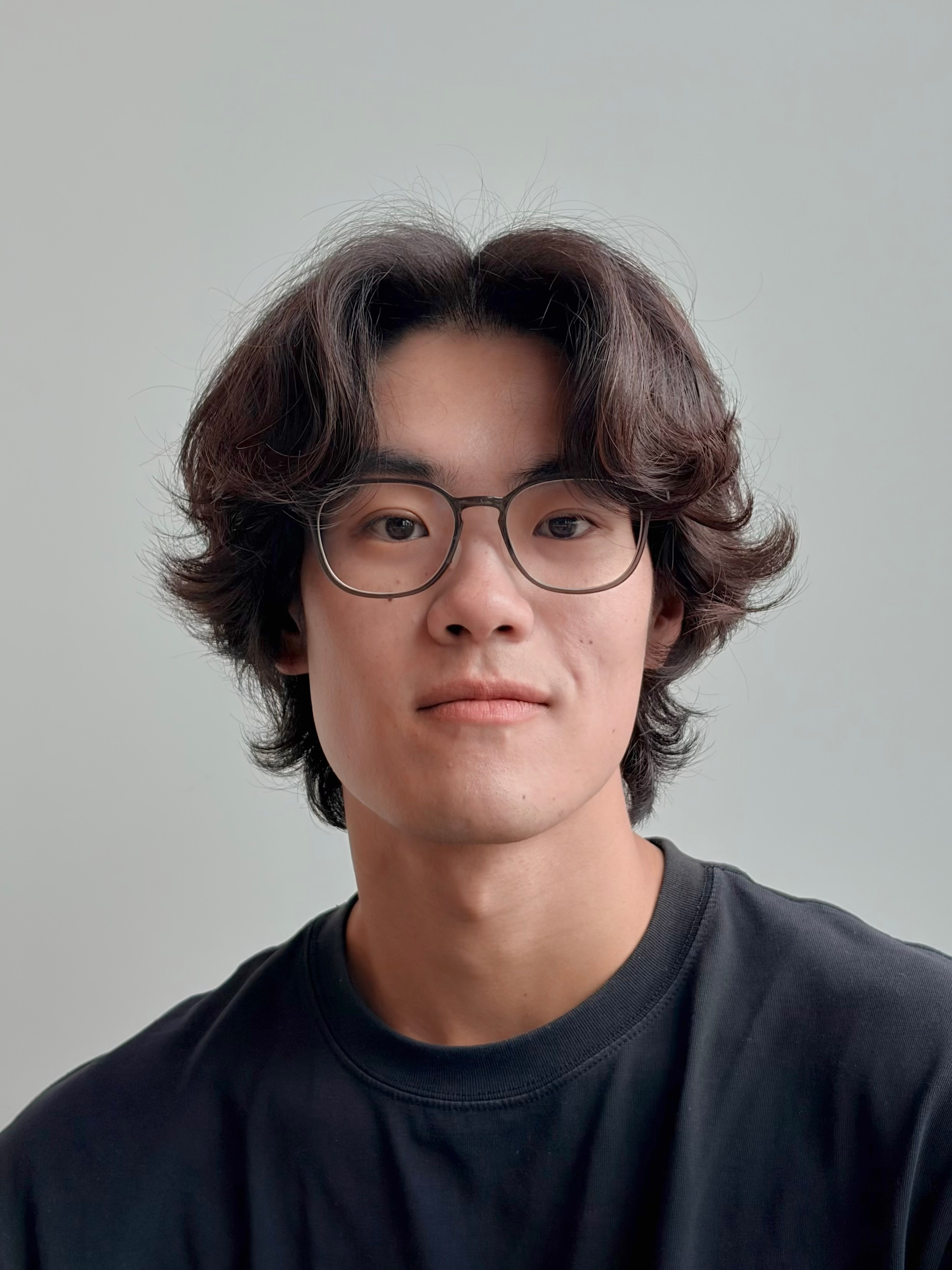 A medium close-up portrait photo of Bryan Min